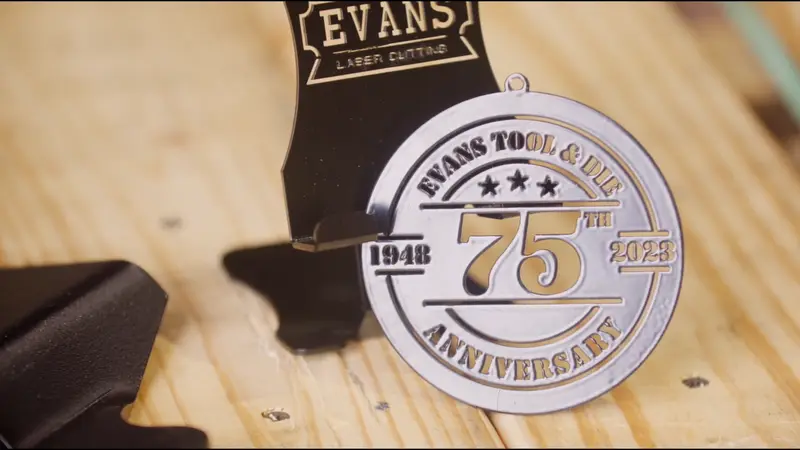 Laser-cut Evans Tool & Die 75th anniversary medallion, 1948 to 2023
